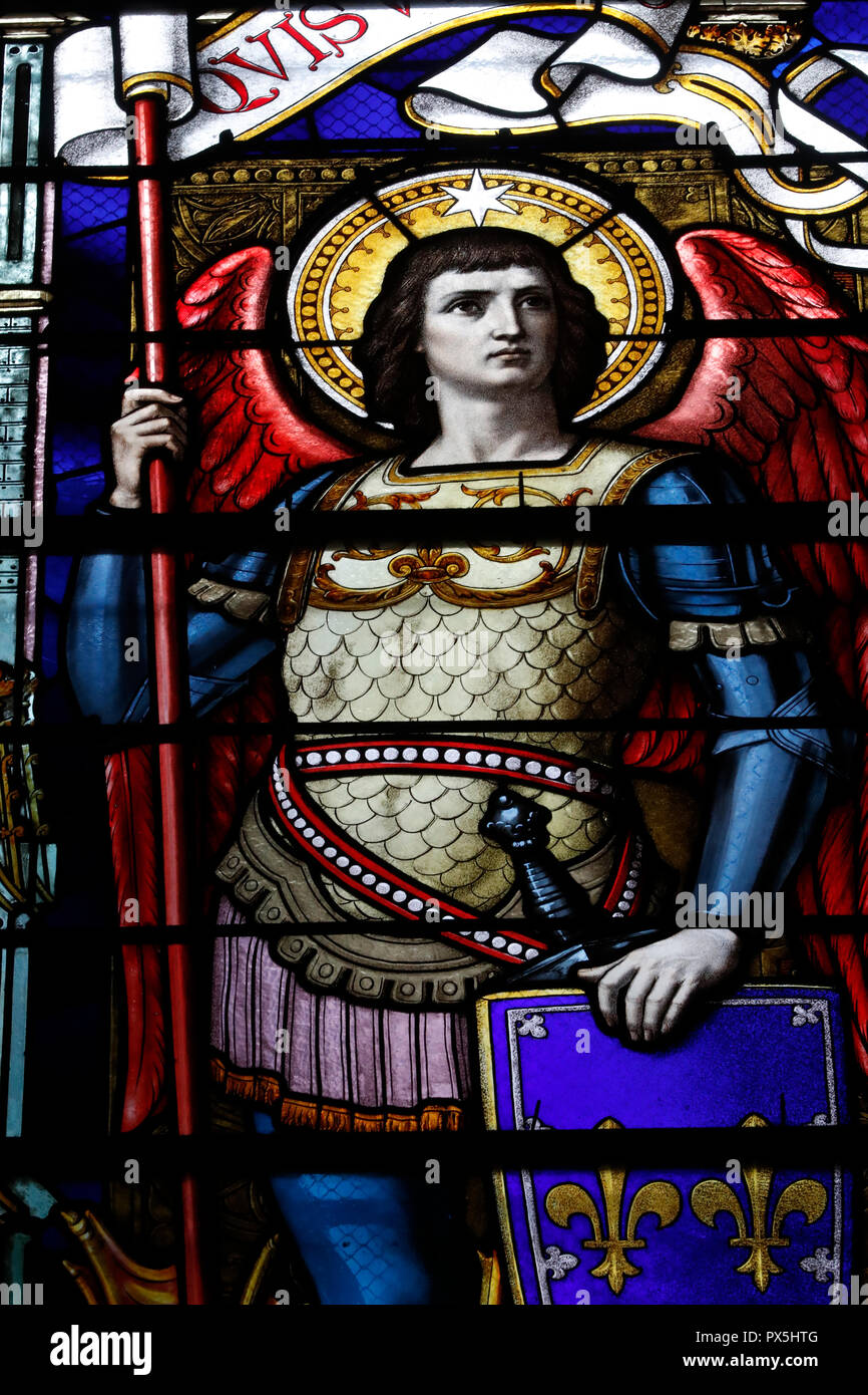Saint-Martin d'Ainay Basilica. Saint Michael archangel. Stained glass window.  Lyon. France. Stock Photo