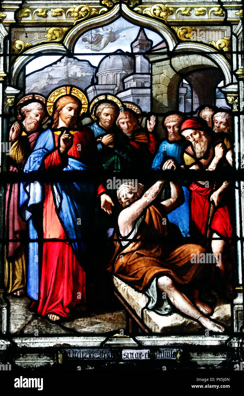 Saint Nizier church.  Stained glass window. Christ healing a paralytic. Lyon. France. Stock Photo