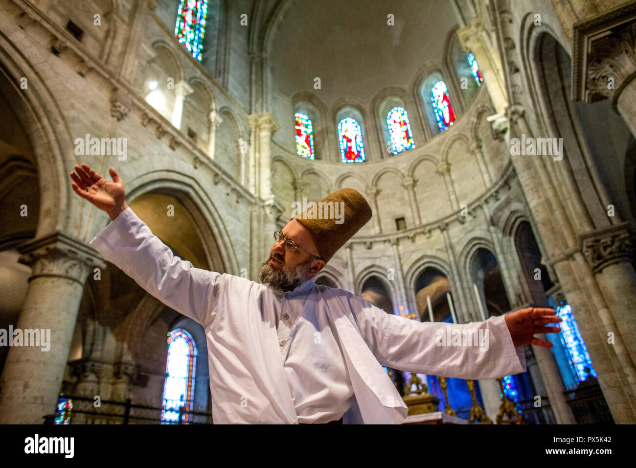 Sufi muslim wedding in St Nicolas's catholic church, Blois, France. Whirling dervish. Stock Photo