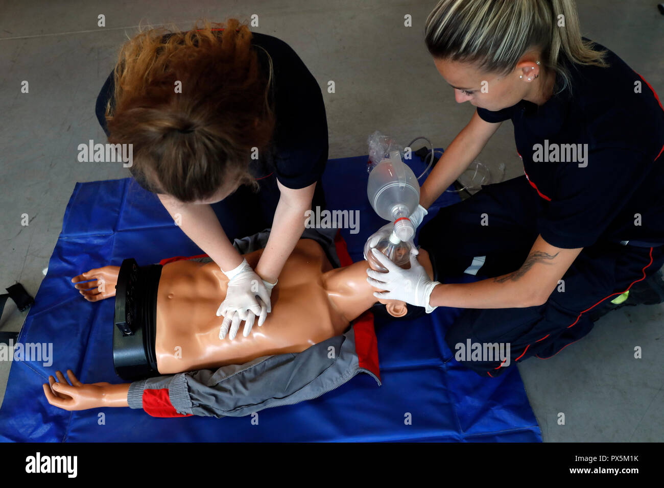 Life-saving first aid on a model.  Training session exercise.  Heart massage.  France. Stock Photo