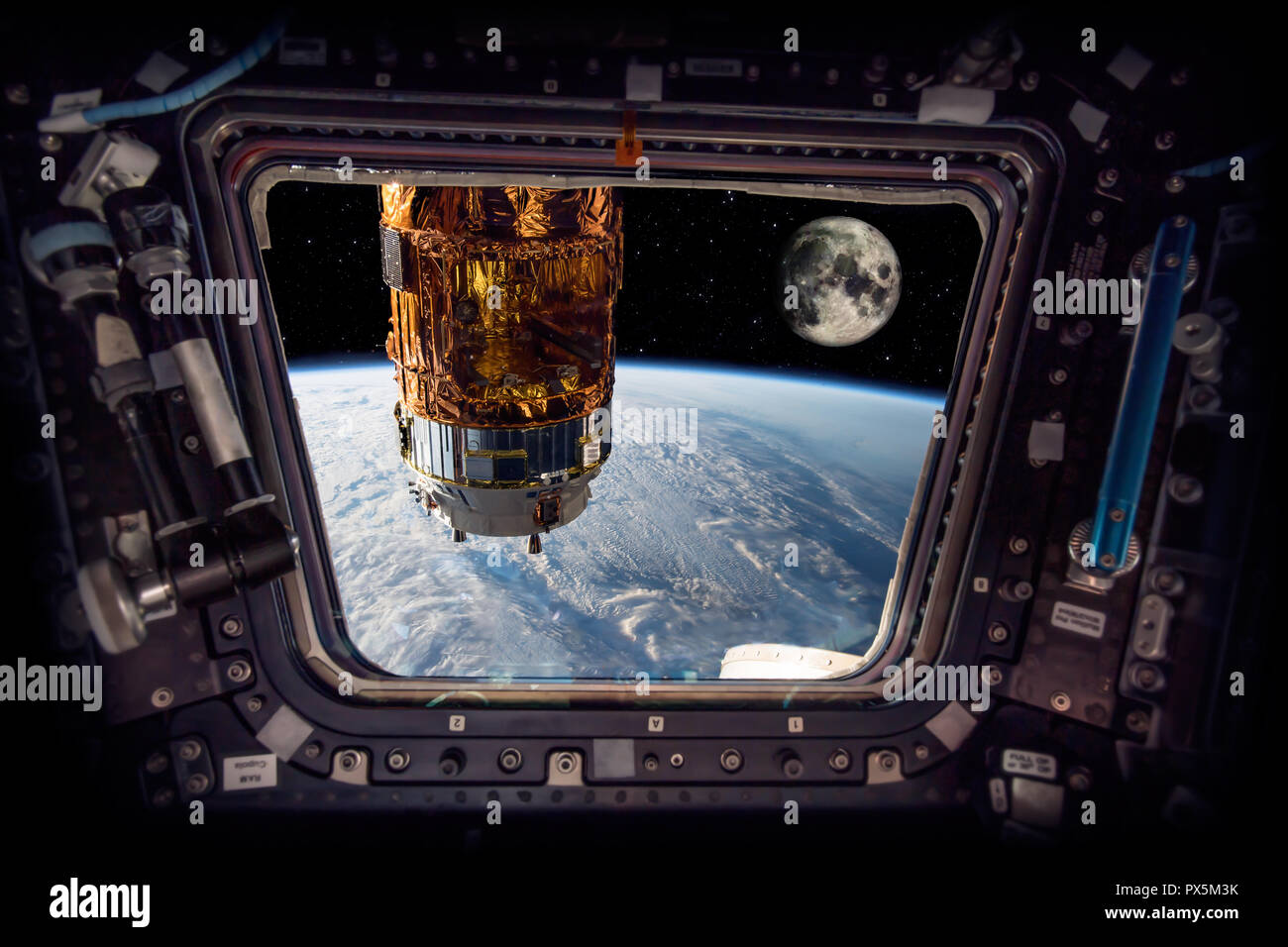 spaceship next to the earth and the moon 'Elements of this image furnished by NASA' Stock Photo