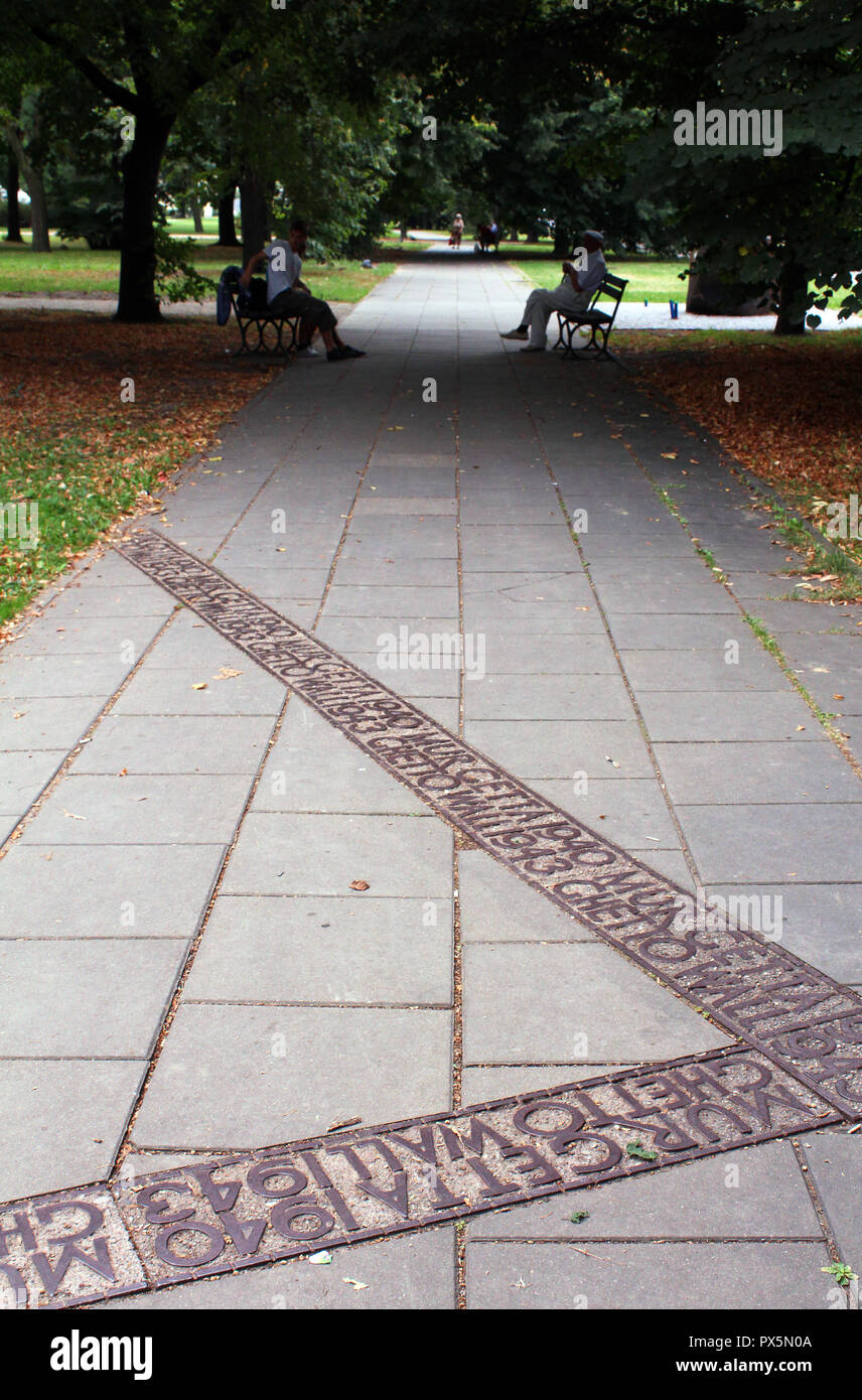 Outline of a former wall surrounding the Jewish ghetto along a stone path in a park, Old Town, Warsaw, Poland Stock Photo