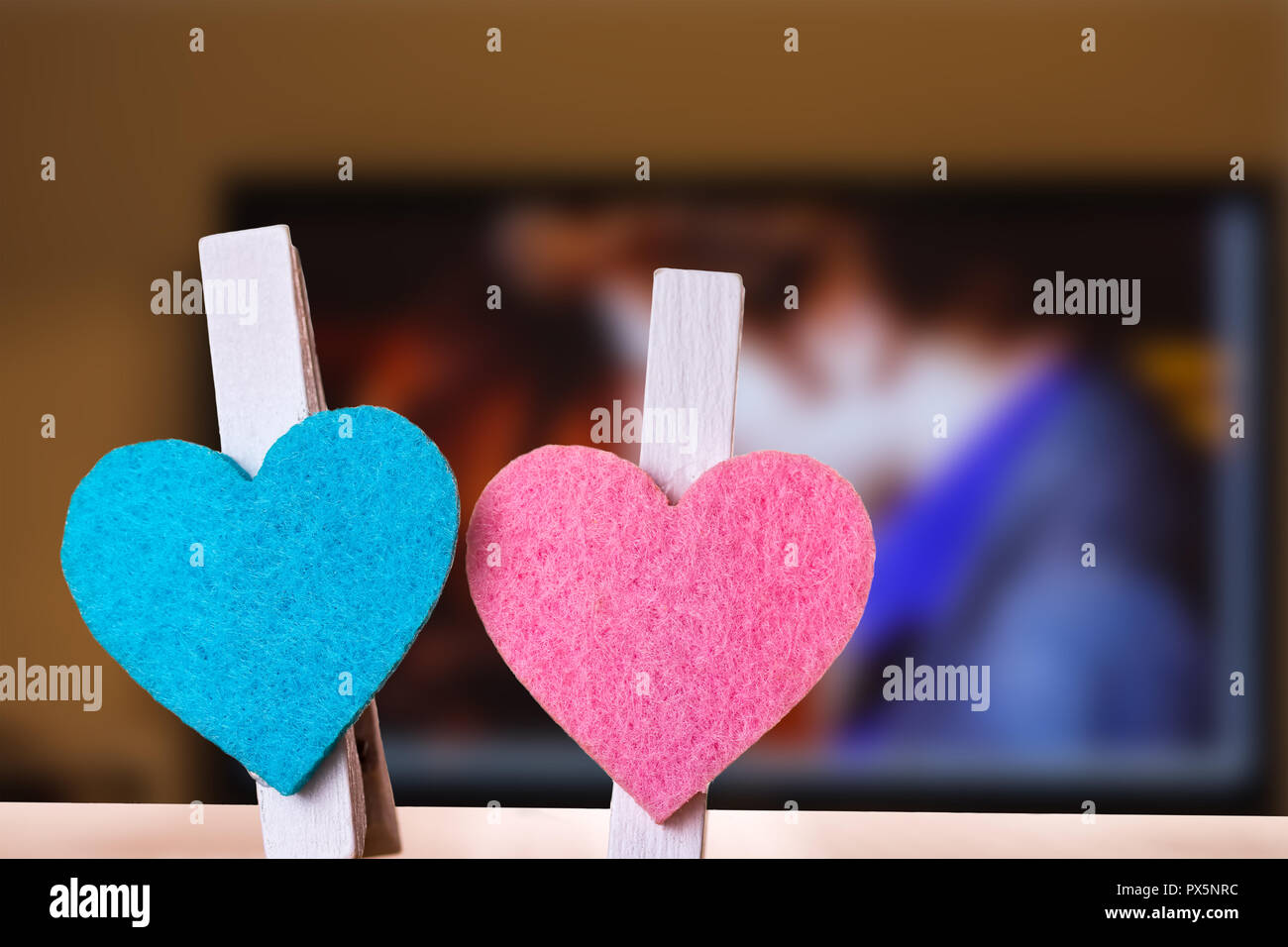 Blue and pink hearts on a clips against romantic movie background. Love and  togetherness abstract concept Stock Photo - Alamy