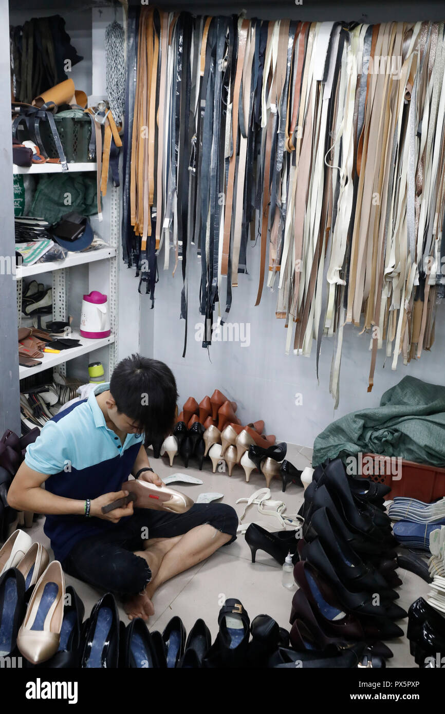 Shoe factory. Young boy working. Ho Chi Minh City. Vietnam Stock Photo