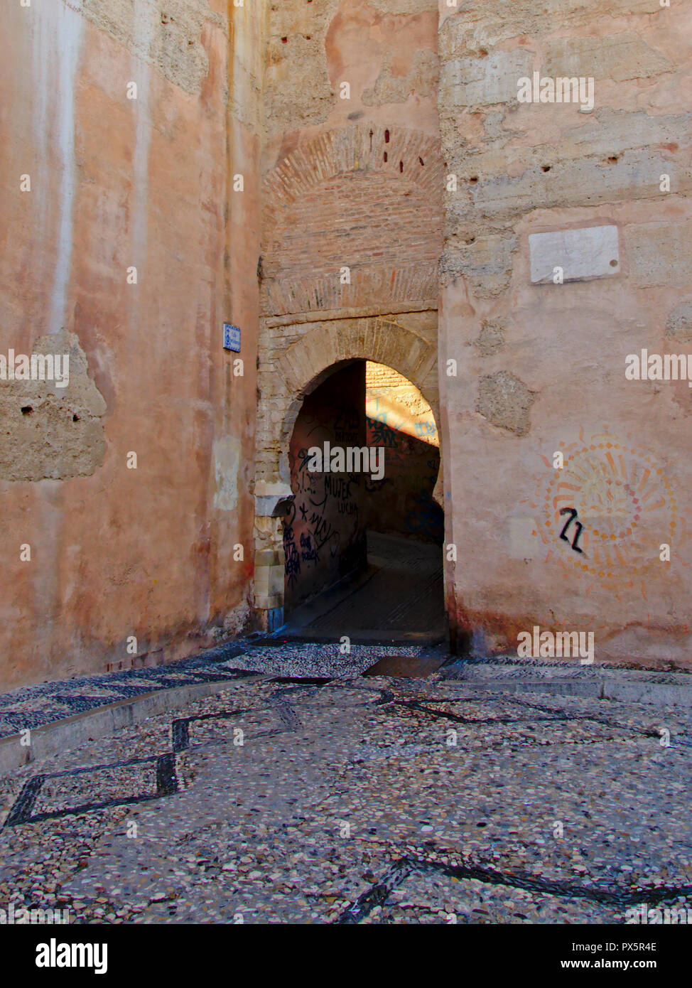 Horseshoe shaped moorish gate in a wall of Albayzin neigborhood, Granada, Andalucia, Spain Stock Photo