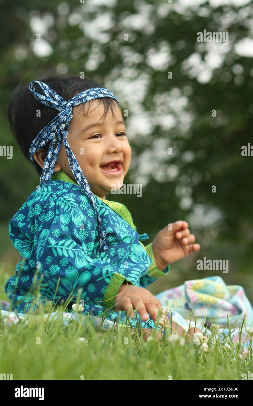 Baby boy outdoor laughing Stock Photo