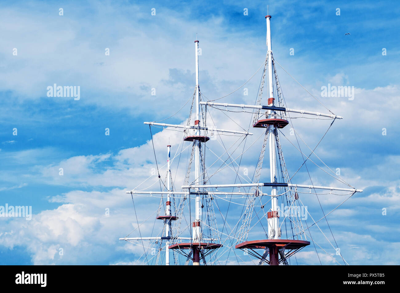 Travel background. Ship masts and rigging of a sailing ship against ...