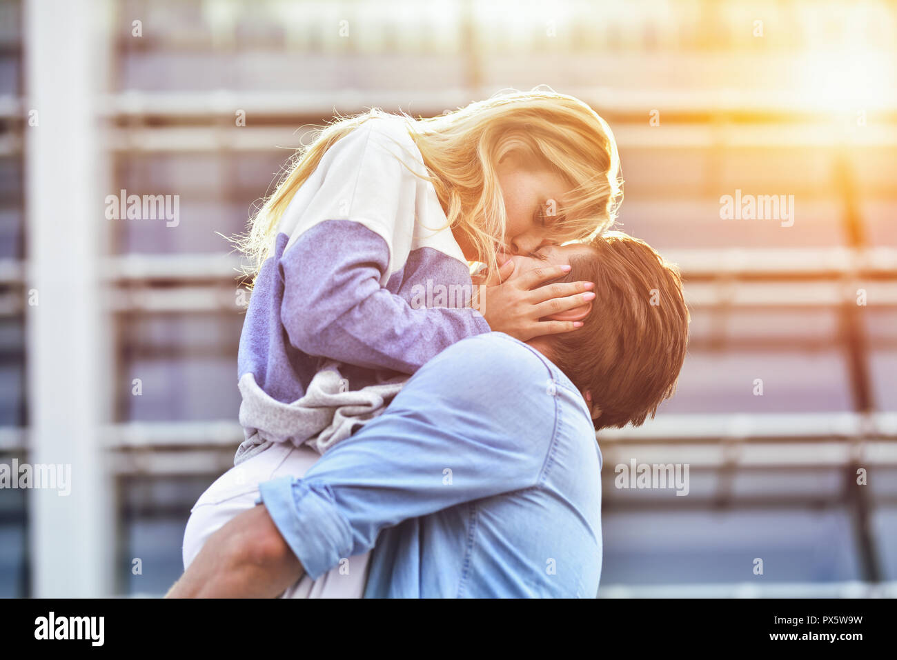 Happy to spending time together. Young beautiful couple outdoor fashion portrait. Stock Photo