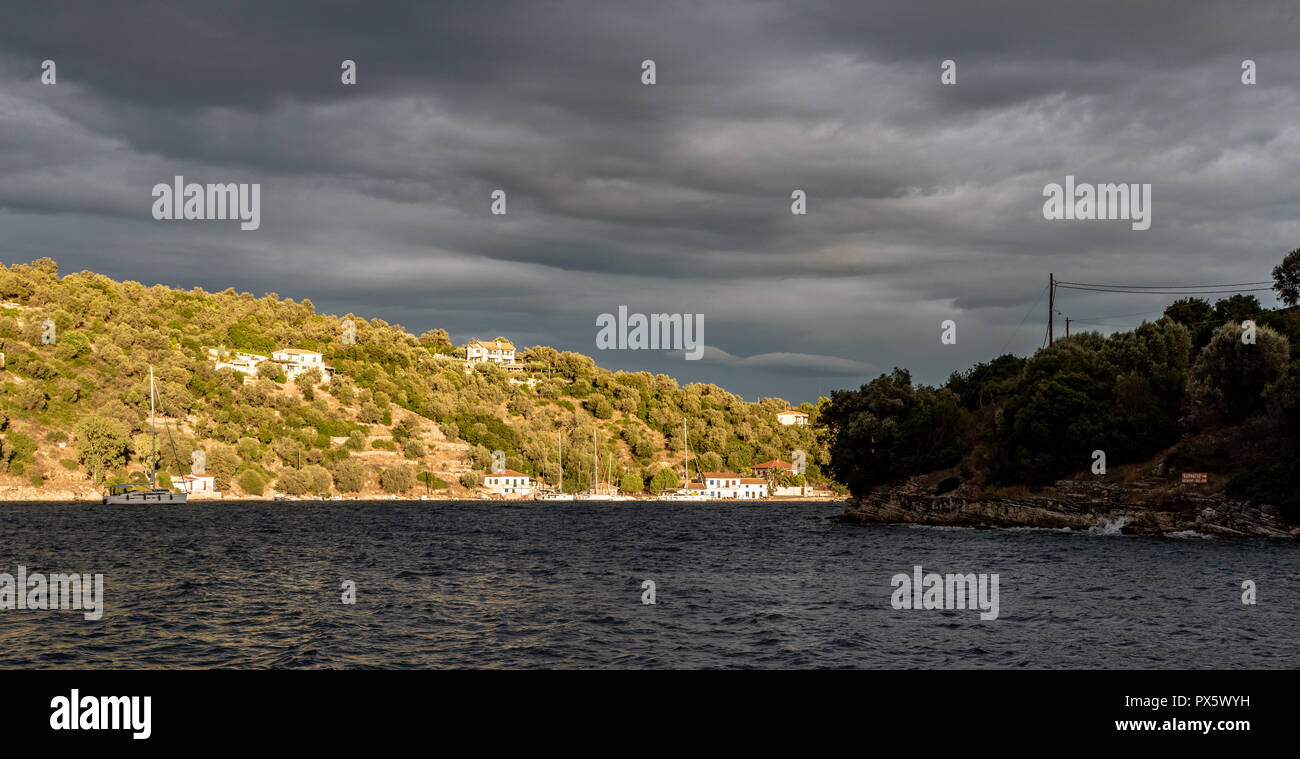 Storm skies build to the east of Little Vathy on the Greek island, Meganissi in the Ionian Stock Photo