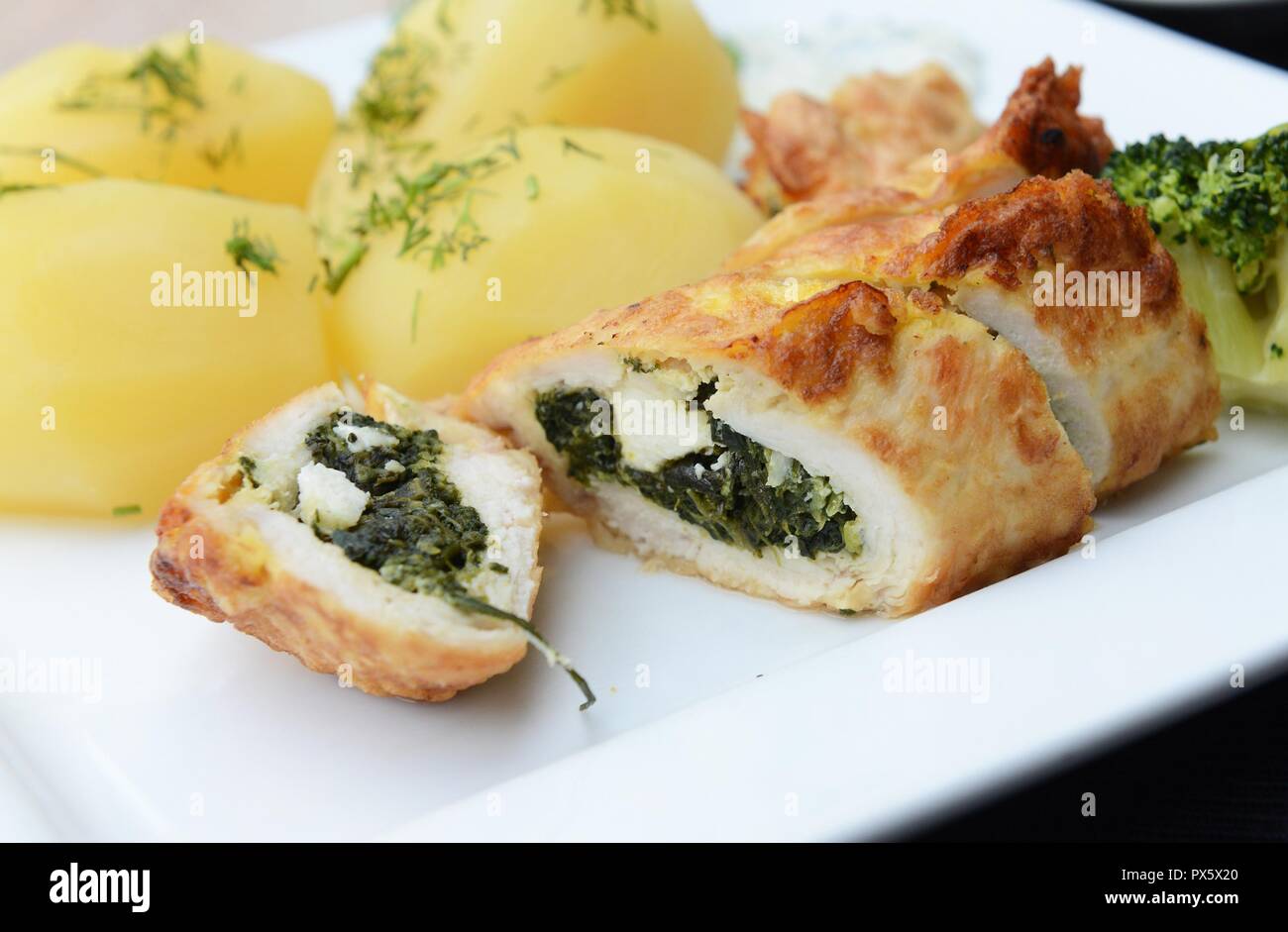 Chicken rolls with spinach and feta cheese Stock Photo Alamy