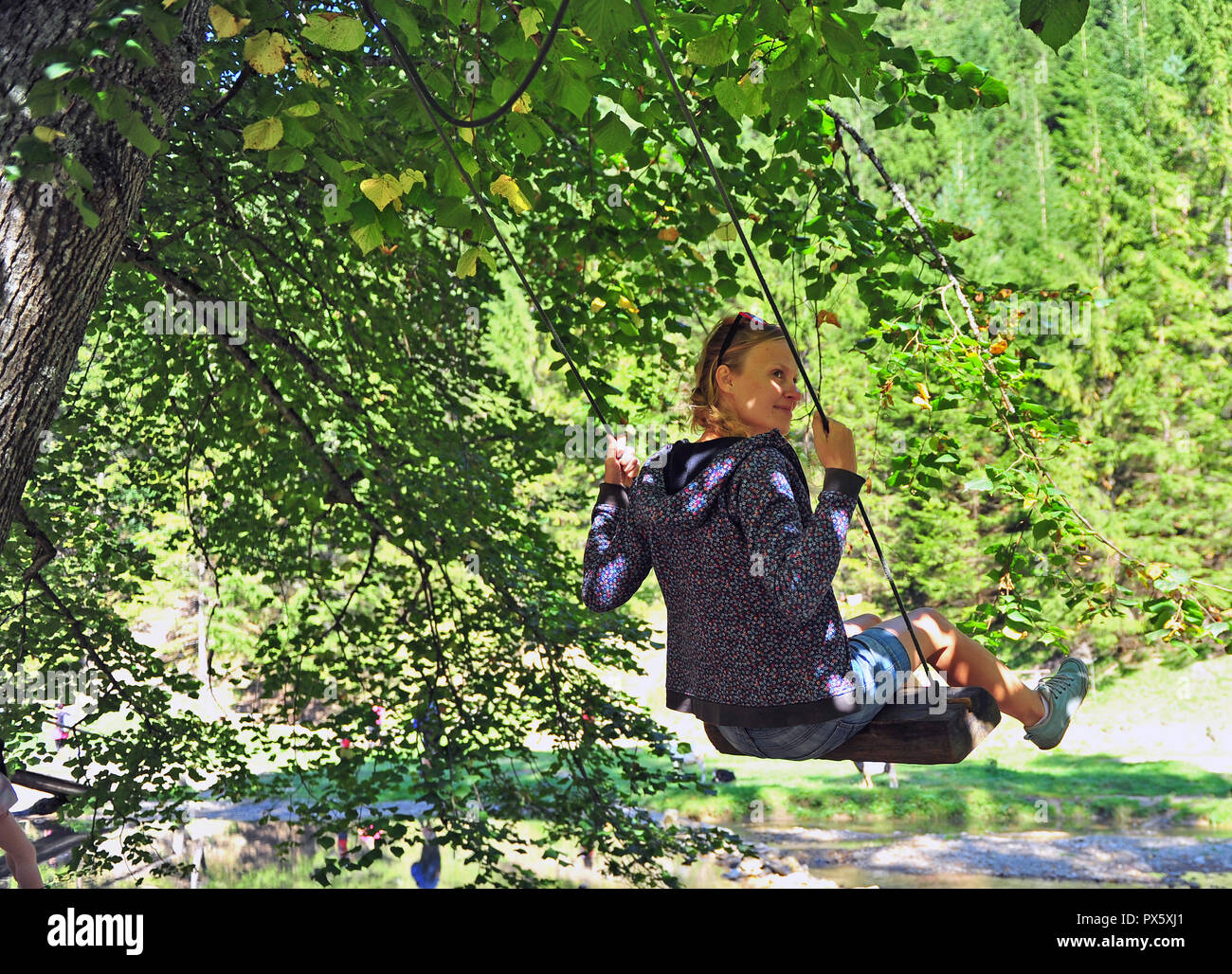 Swinging in tree hi-res stock photography and images - Alamy