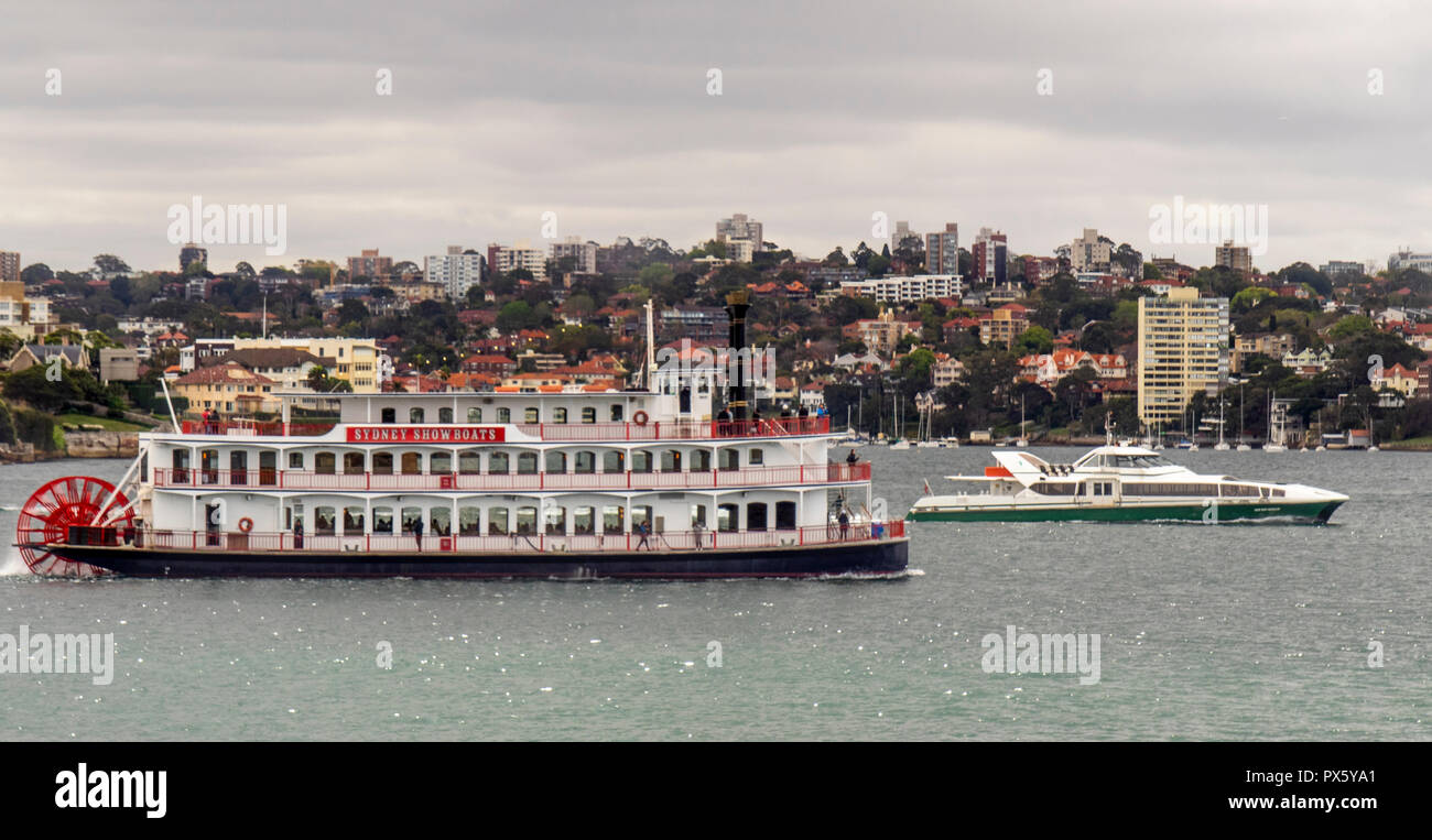 Paddle wheel showboat and Supercat catamaran Saint Mary Mackillop on on Sydney Harbour Sydney NSW Australia. Stock Photo