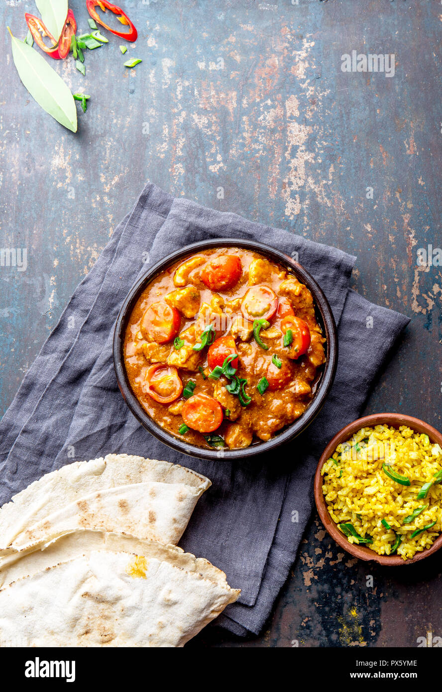 INDIAN FOOD. ROGAN JOSH curry sauce. Pork rogan josh with rice and naan