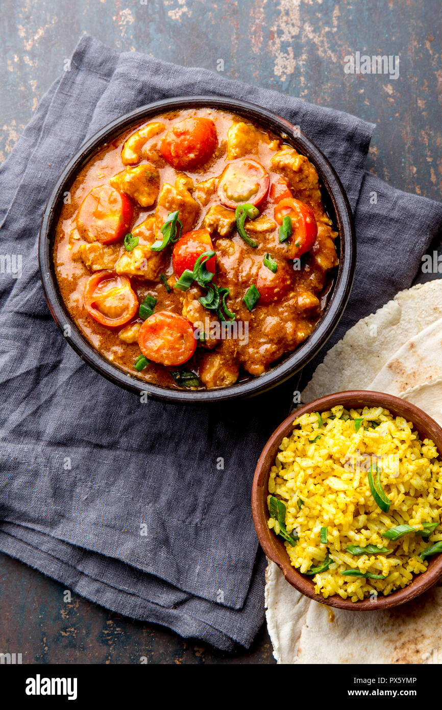 INDIAN FOOD. ROGAN JOSH curry sauce. Pork rogan josh with rice and naan