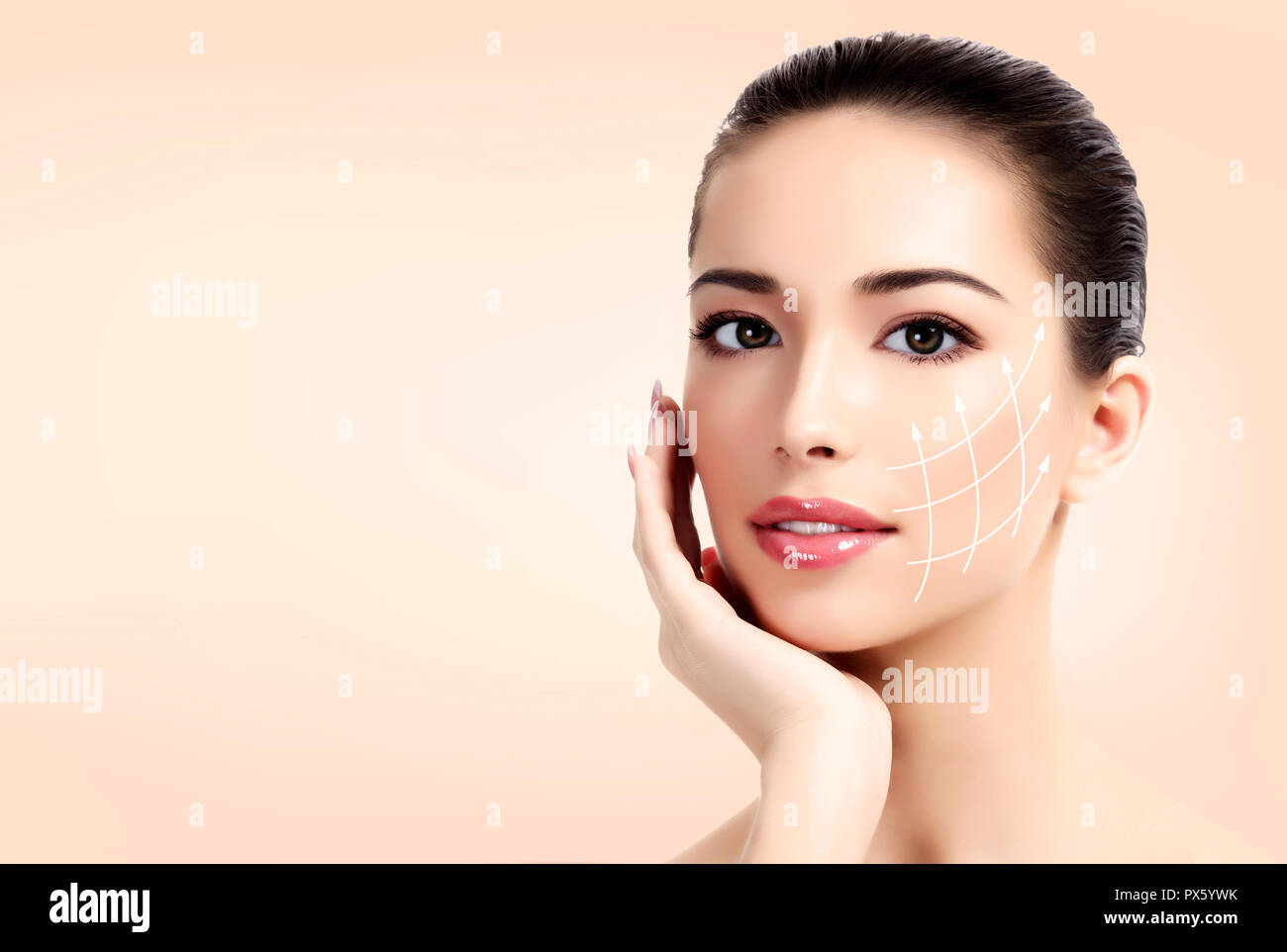 Closeup shot of female pretty face with white arrows on skin for cosmetic medical procedures, pastel background. Skin care concept Stock Photo