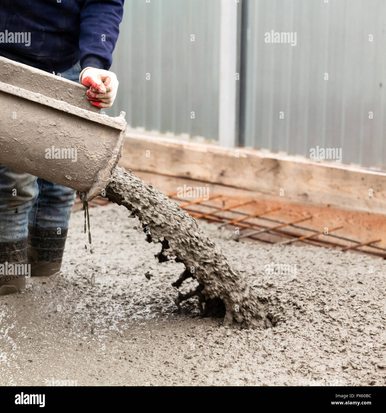 Closeup shot of concrete casting on reinforcing metal bars of floor in  industrial construction site Stock Photo - Alamy