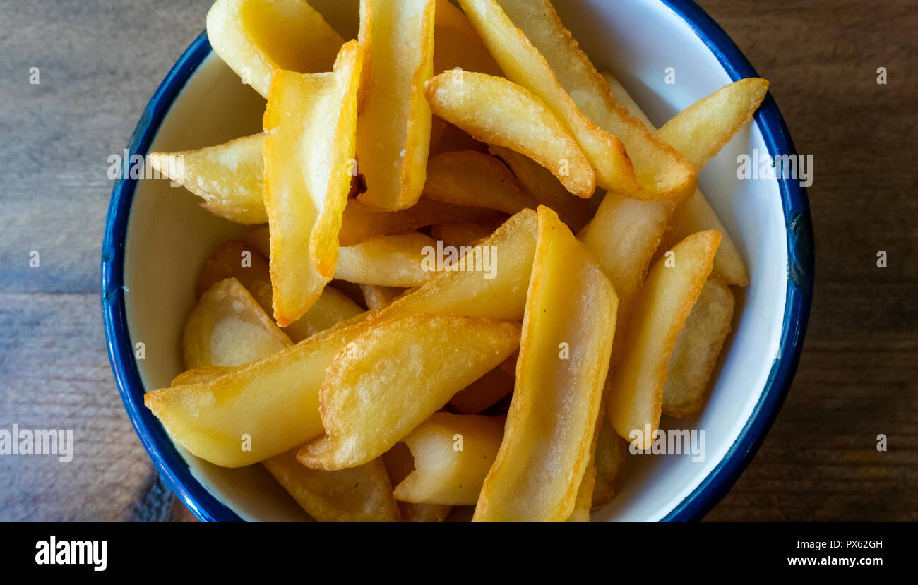 Fries (chips) Spanish style in a tapas bar in Seville Stock Photo Alamy