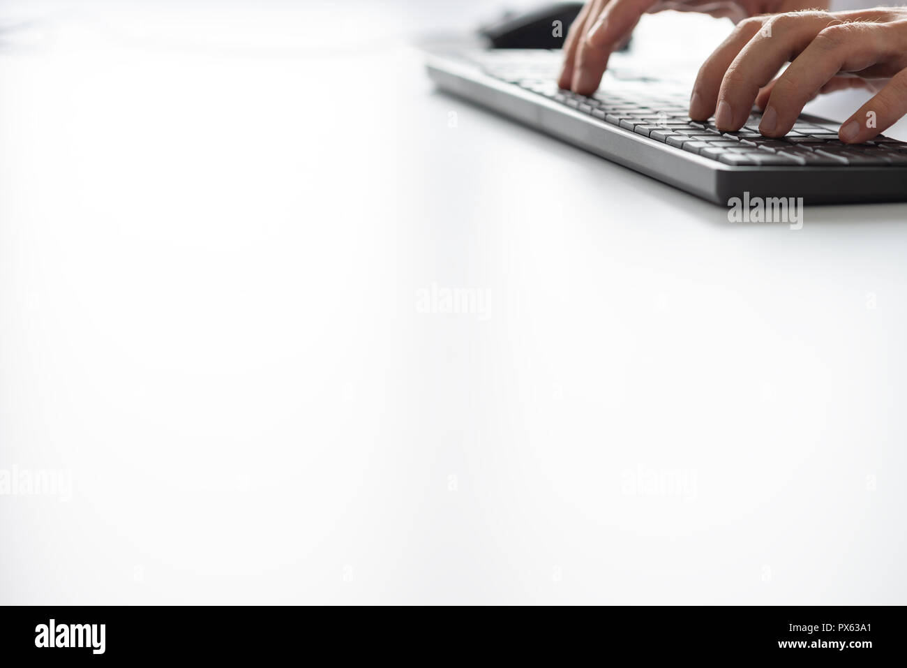 Businessman typing on computer keyboard. With copy space ready for your text. Stock Photo