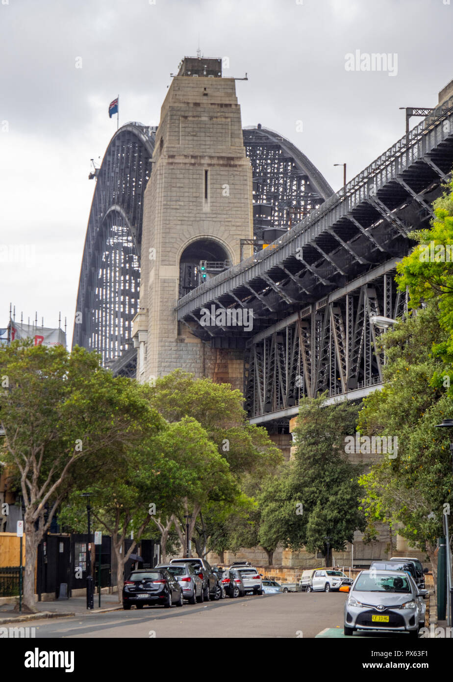 Granite pylon and Sydney Harbour bridge, landmark suspension bridge in Sydney NSW Australia. Stock Photo
