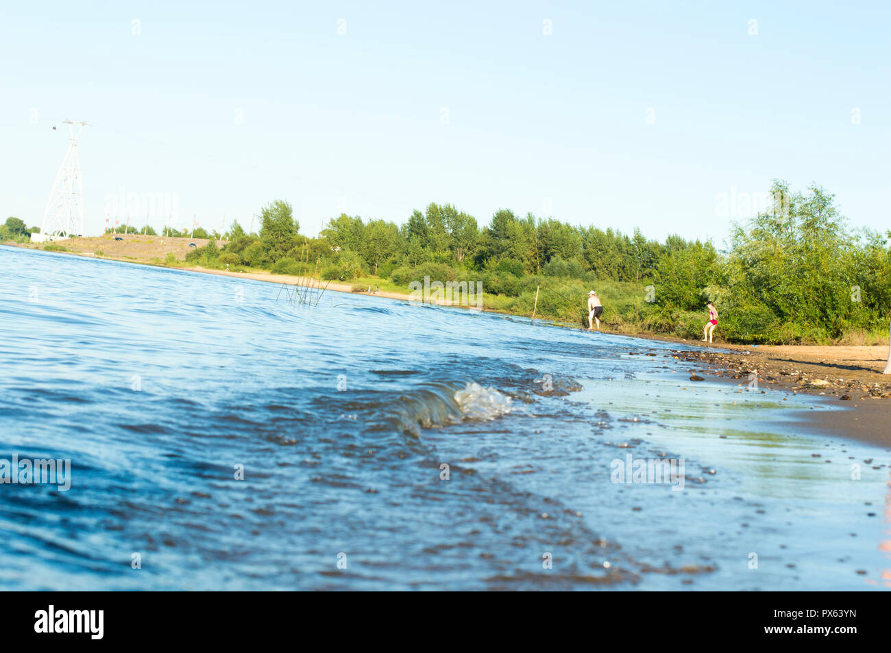 Volga river. Summer, sunny day. Sandy sand. Figures of sand, footprints and landscape. Close-up. Russia. Stock Photo