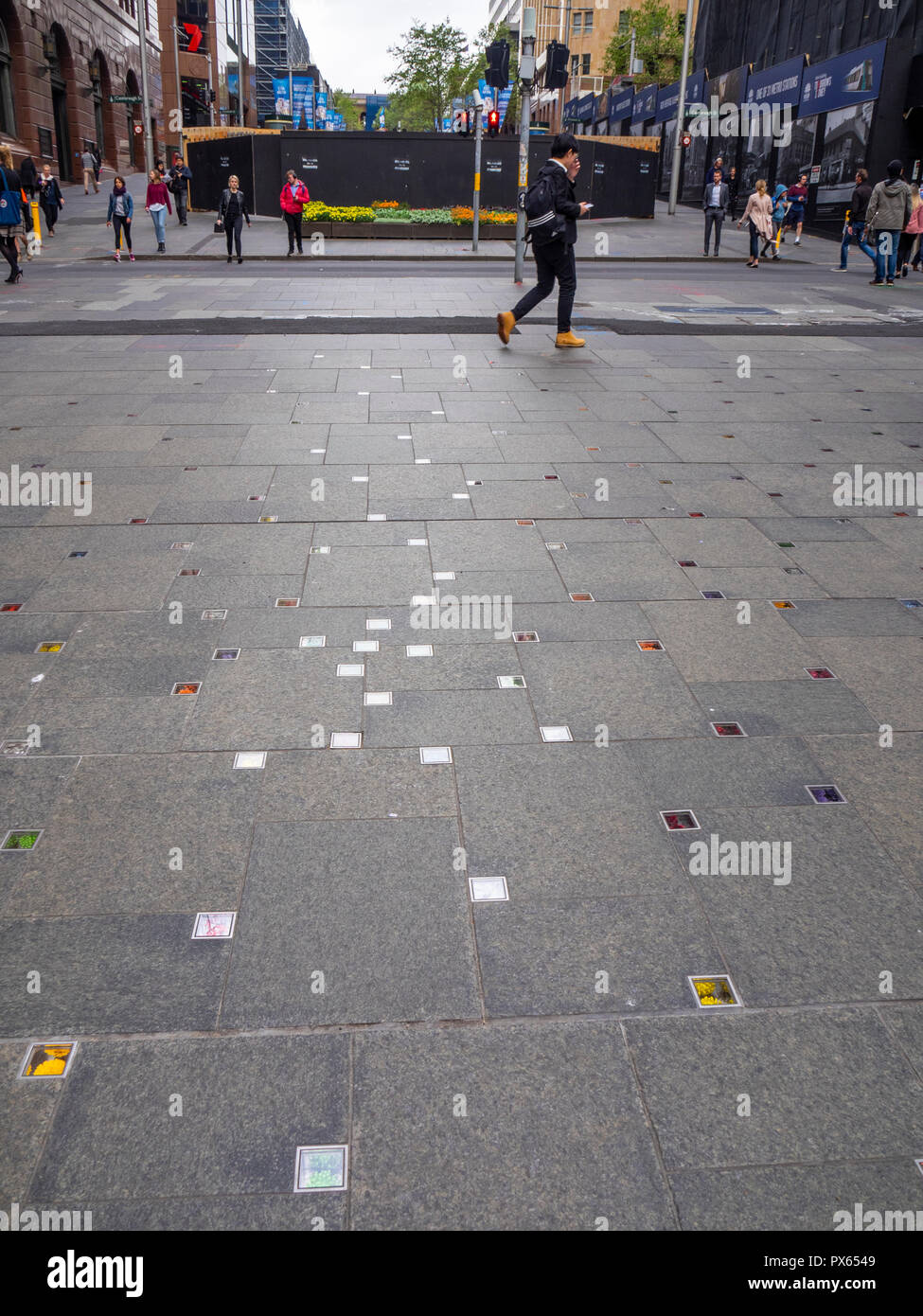 Lindt Cafe siege Memorial of inlaid flowers in the granite pavement of Martin Place Mall Sydney NSW Australia. Stock Photo