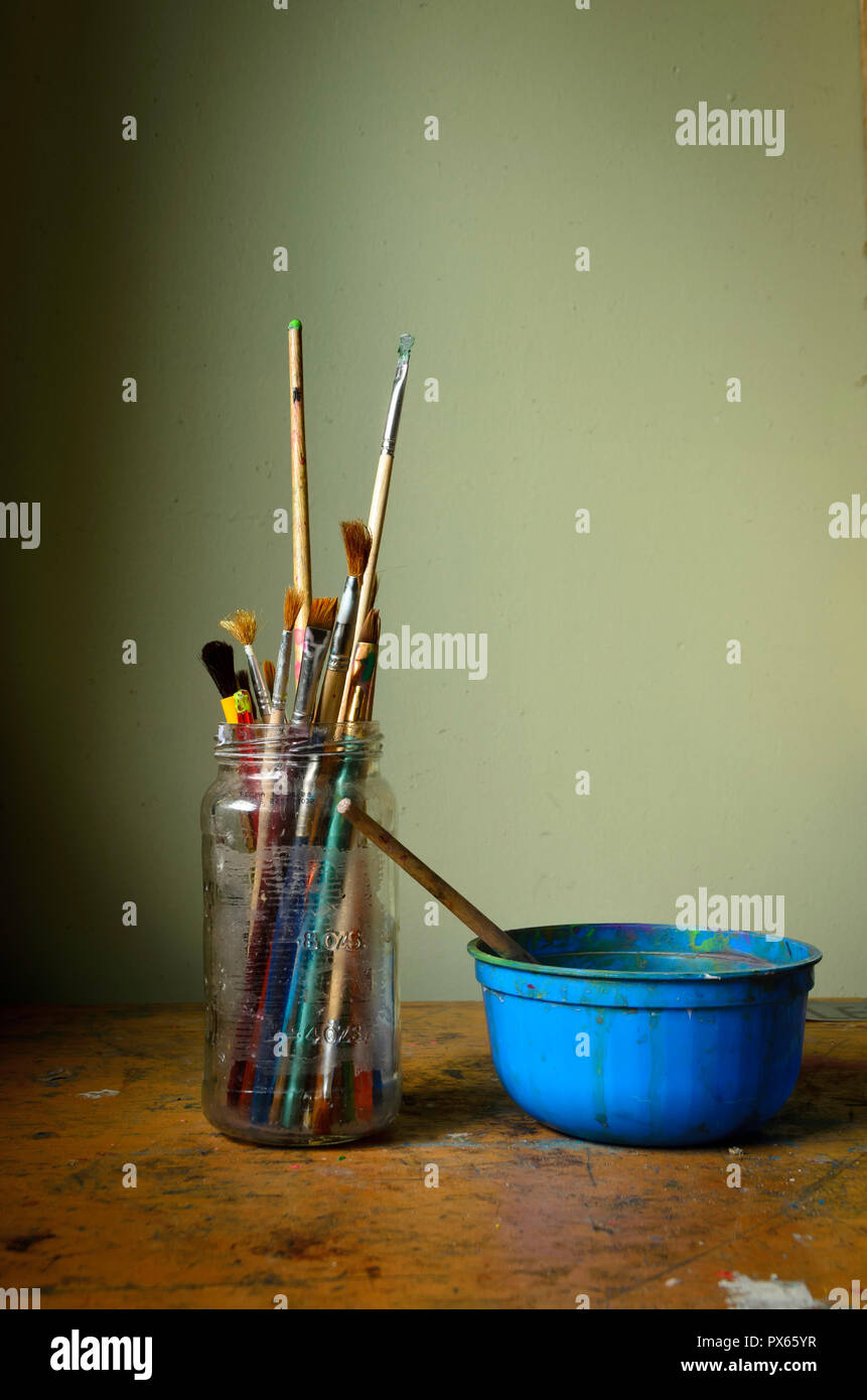 Paintbrushes in a jar in a art studio Stock Photo Alamy