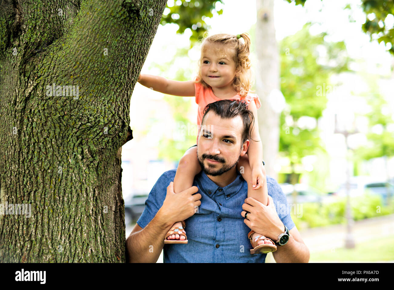 A Father and Daughter in a park on summer day Stock Photo - Alamy