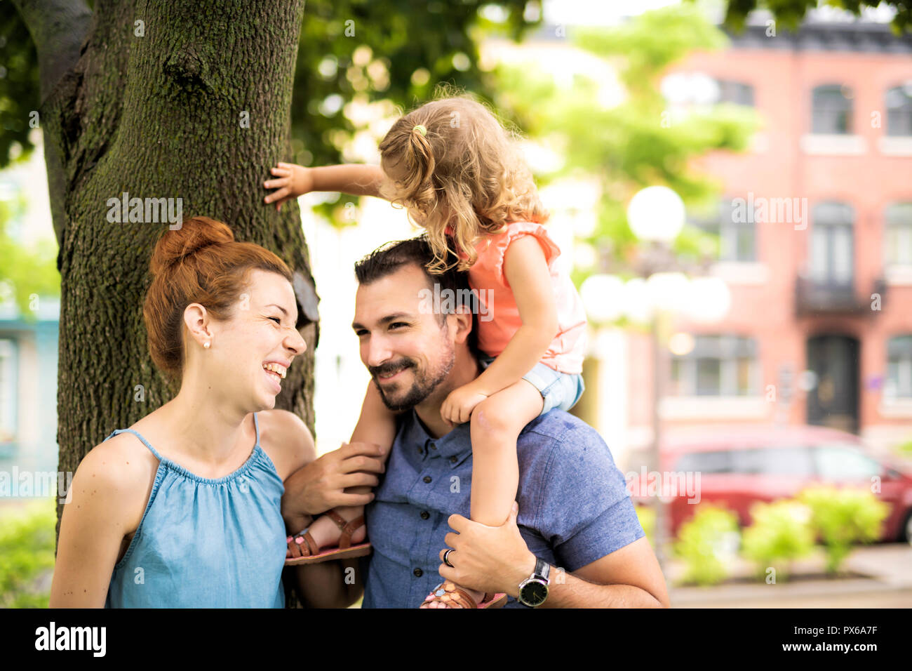 A Portrait of happy family in park on a sunny day Stock Photo - Alamy