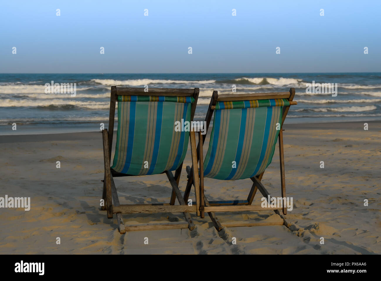 Two deckchairs for relaxing on the beach Stock Photo - Alamy