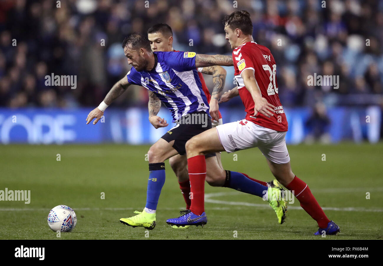 Sheffield Wednesday's Steven Fletcher (left) battles for the ball with Middlesbrough's Muhamed Besic (centre) and Dael Fry during the Sky Bet Championship match at Hillsborough, Sheffield. Stock Photo