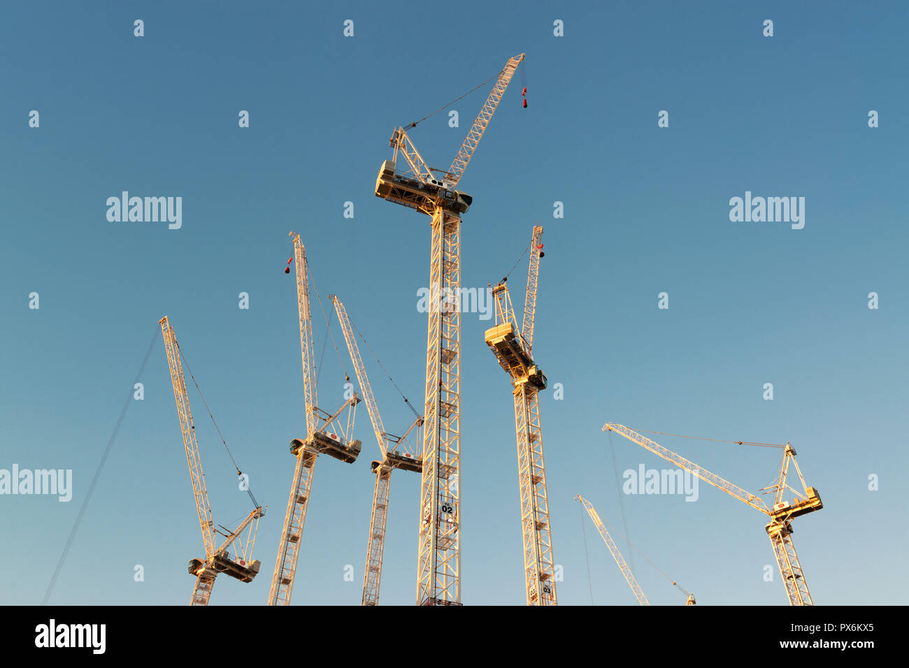A number of Sisk cranes stand idle during the early evening on the site of the Circle Square complex on Oxford Road, Manchester, UK. Stock Photo