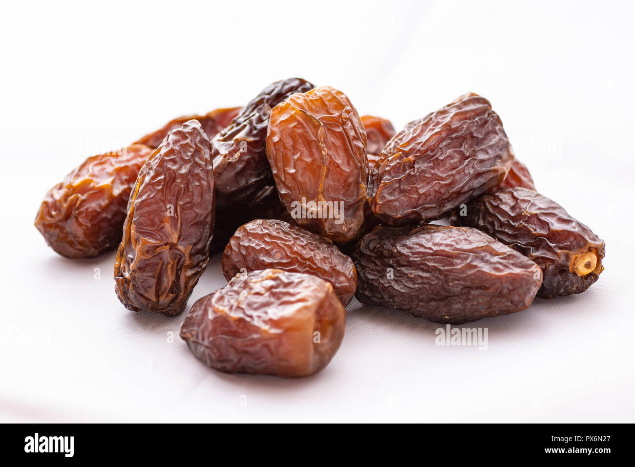 dried dates on a white background Stock Photo