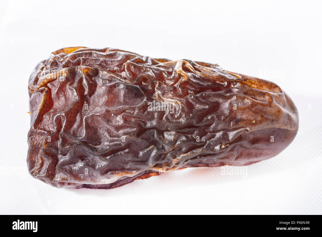dried dates on a white background Stock Photo