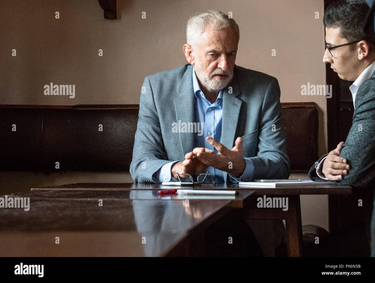 Jeremy Corbyn leader of the labour Party sat talking to a newspaper journalist Stock Photo