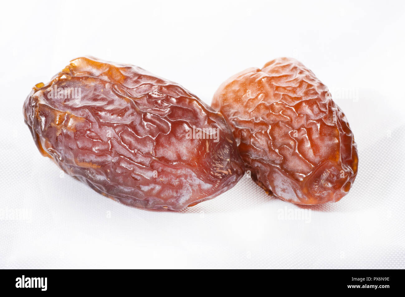 dried dates on a white background Stock Photo