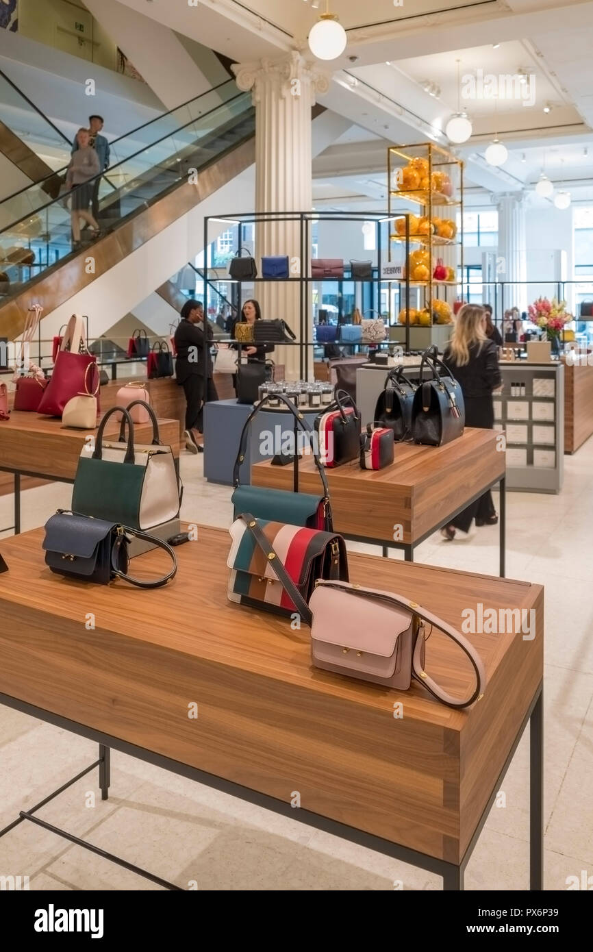 Upmarket handbags on display in Selfridges Department Store, London, England, UK Stock Photo