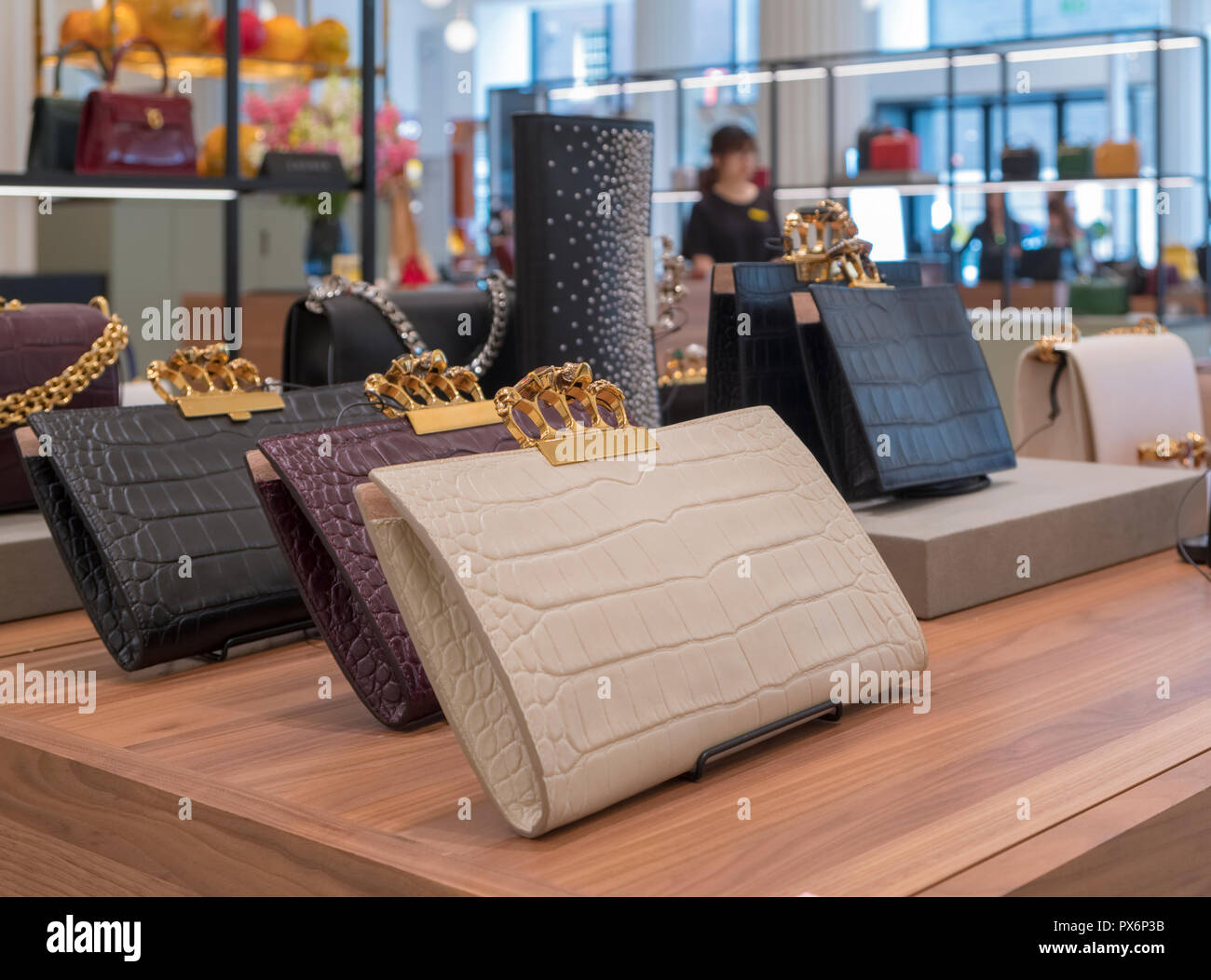 Upmarket handbags on display in Selfridges Department Store, London, England, UK Stock Photo