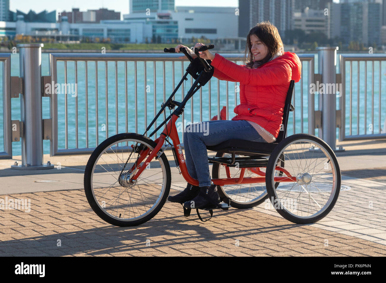 Detroit, Michigan - People try out adaptive bicycles, now offered through MoGo, Detroit's bike share system. The adaptive bikes are designed for peopl Stock Photo