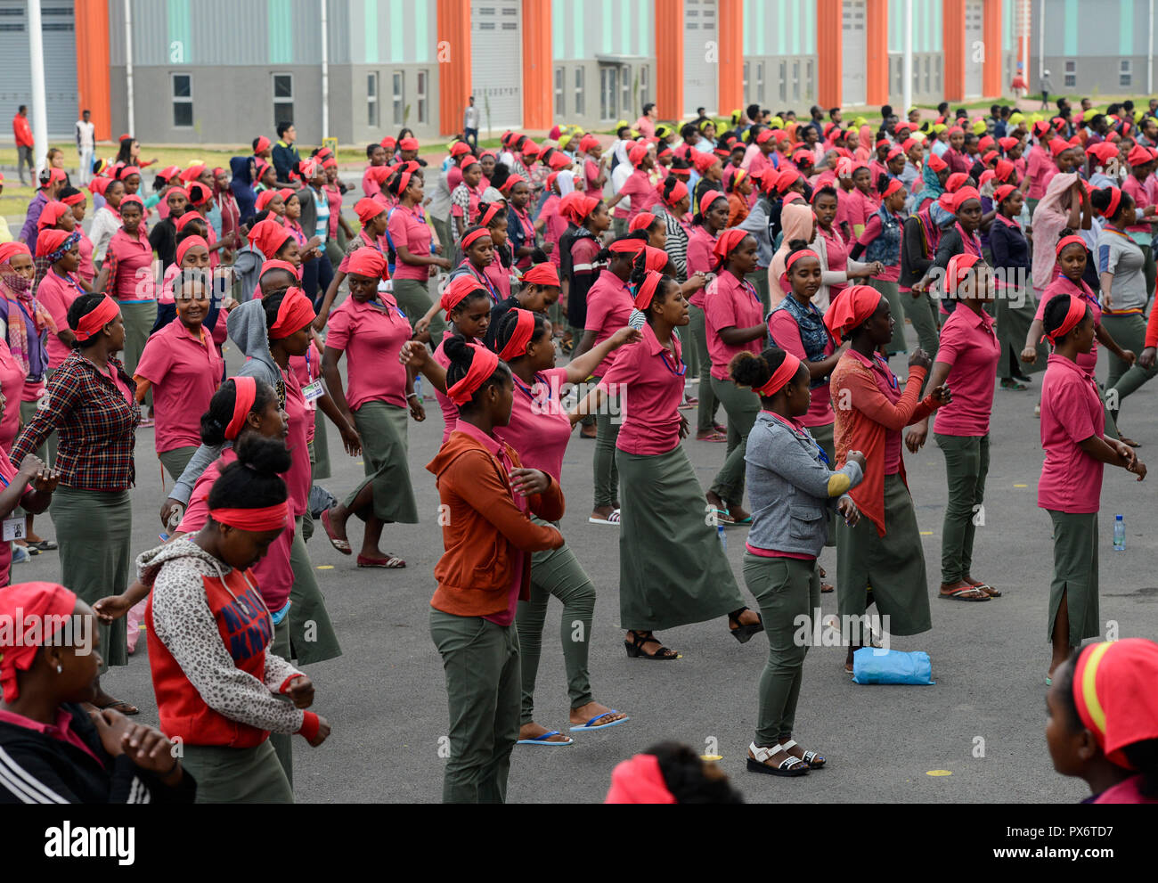 ETHIOPIA , Southern Nations, Hawassa or Awasa, Hawassa Industrial Park, chinese-built for the ethiopian government to attract foreign investors with low rent and tax free to establish a textile industry and create thousands of new jobs, taiwanese company Everest Textile Co. Ltd., women worker do a 15 minutes morning sports before work as motivation training Stock Photo