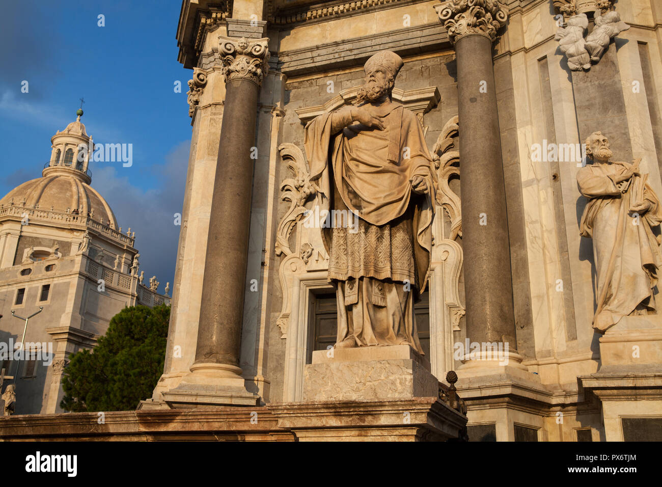 Statue in front of the Duomo in Catania, Sicily with the dome of Santa Agata in the background to the left Stock Photo