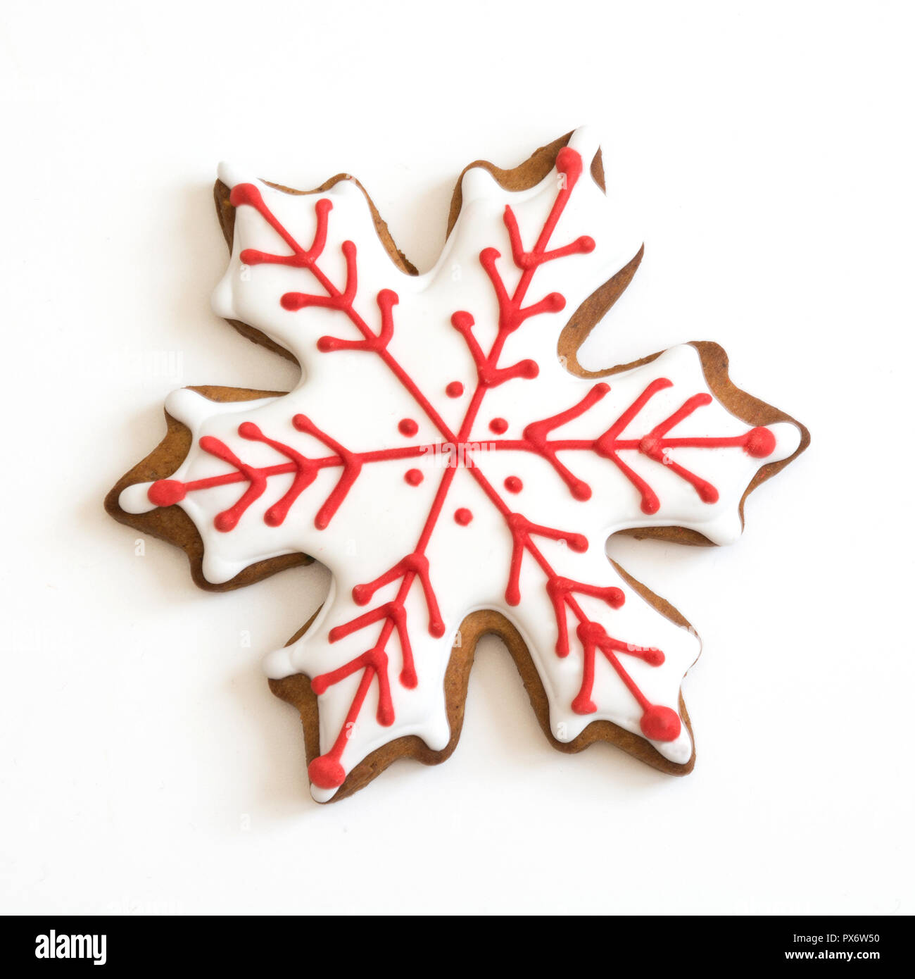 Snowflake shape christmas gingerbread isolated on white background. Stock Photo