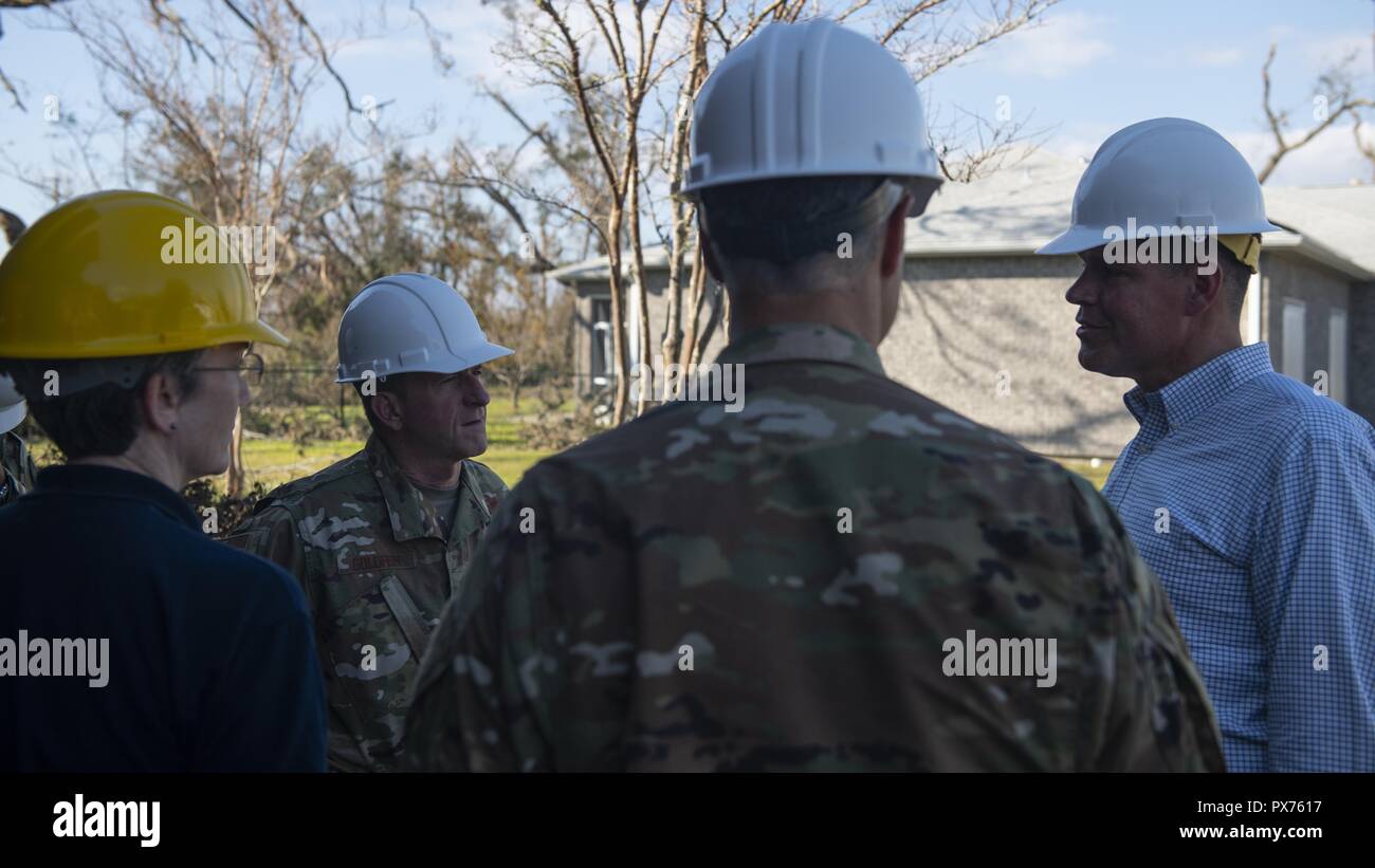 John W. Henderson, right, the Assistant Secretary of the Air Force for Installations, Environment and Energy, speaks with Air Force senior leaders at Tyndall Air Force Base, Florida, Oct. 14, 2018, October 14, 2018. Air Force senior leaders toured Tyndall Air Force Base to assess the damage from Hurricane Michael, one of the most intense tropical cyclones to ever hit the U.S. (U.S. Air Force photo by Senior Airman Joseph Pick). () Stock Photo