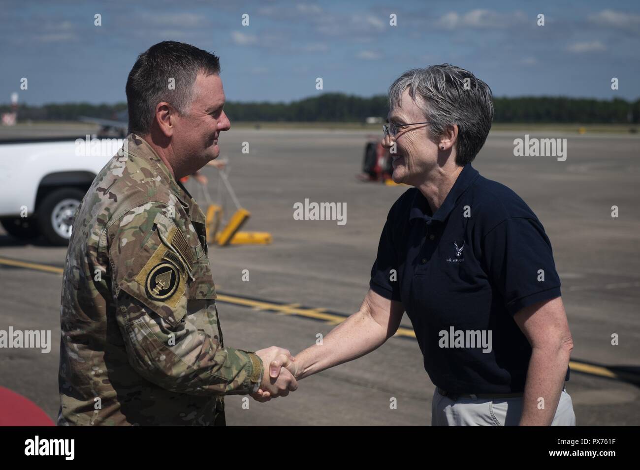 U.S. Air Force Lt. Gen. Brad Webb, left, commander of Air Force Special Operations Command, greets Secretary of the Air Force Heather Wilson at Hurlburt Field, Florida, Oct. 14, 2018, October 14, 2018. Aircrew members with the 8th Special Operations Squadron transported Air Force senior leaders from Hurlburt Field to Tyndall Air Force Base to assess the damage from Hurricane Michael, one of the most intense tropical cyclones to ever hit the U.S. (U.S. Air Force photo by Senior Airman Joseph Pick). () Stock Photo