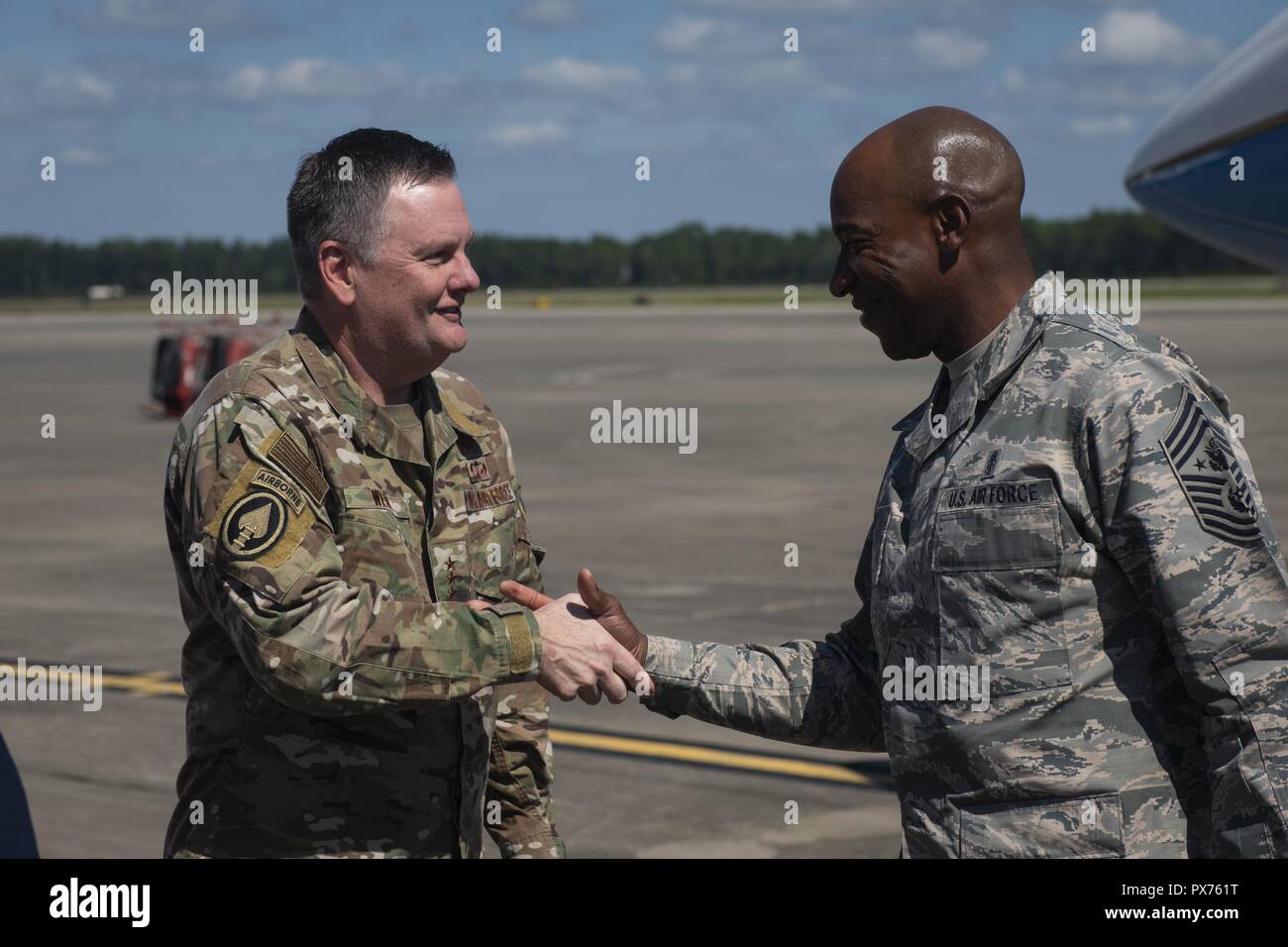 U.S. Air Force Lt. Gen. Brad Webb, left, commander of Air Force Special Operations Command, greets Chief Master Sgt. of the Air Force Kaleth O, October 14, 2018. Wright at Hurlburt Field, Florida, Oct. 14, 2018. Aircrew members with the 8th Special Operations Squadron transported Air Force senior leaders from Hurlburt Field to Tyndall Air Force Base to assess the damage from Hurricane Michael, one of the most intense tropical cyclones to ever hit the U.S. (U.S. Air Force photo by Senior Airman Joseph Pick). () Stock Photo