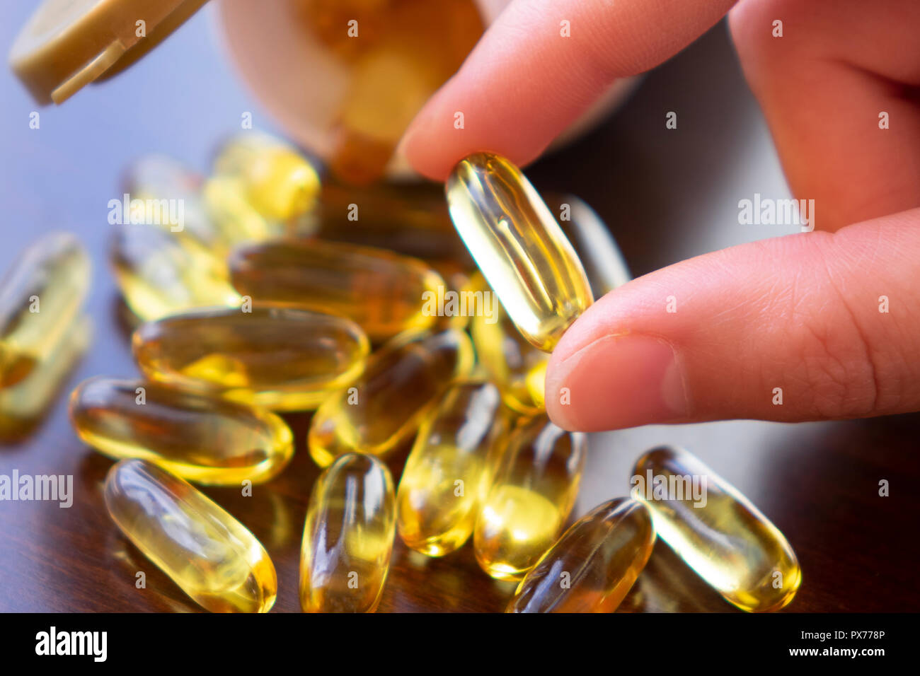 Healthy Diet Nutrition. Woman Holding Fish Oil Pill In Hand. Omega3