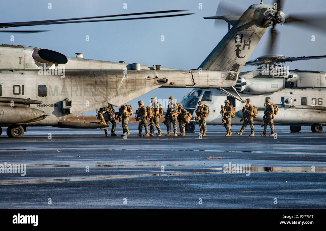 181017-N-WO404-139 KEFLAVIK, Iceland (Oct. 17, 2018) U.S. Marines, assigned to the 24th Marine Expeditionary Unit, embark a CH-53 Super Stallion helicopter, during a simulated air assault as part of exercise Trident Juncture 2018 in Keflavik, Iceland, Oct. 17, 2018. Trident Juncture, a NATO-led exercise, hosted by Norway, will include around 50,000 personnel from NATO countries, as well as Finland and Sweden, and will test NATO’s collective response to an armed attack against one ally, invoking Article 5 of the North Atlantic Treaty. (U.S. Navy photo by Mass Communication Specialist 2nd Class  Stock Photo