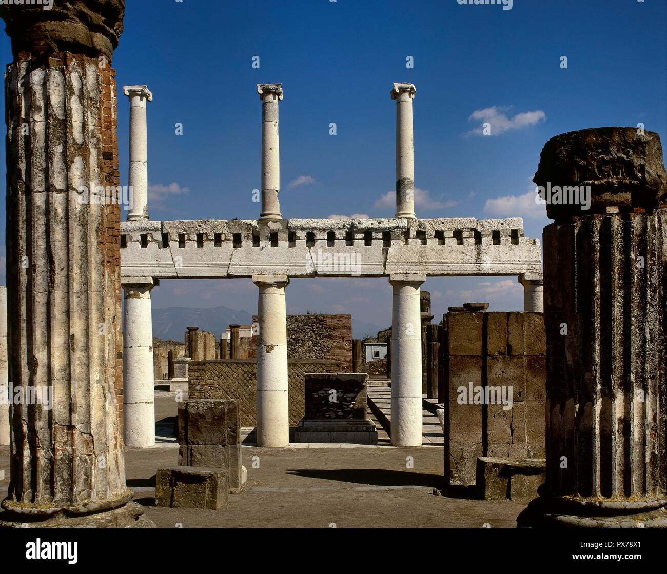 Italy. Pompeii. View of the Forum colonnade with the double order of the columns (Ionic in the upper part and Doric in the lower part) separated by an architrave. Limestone. Imperial epoch. La Campania. Stock Photo
