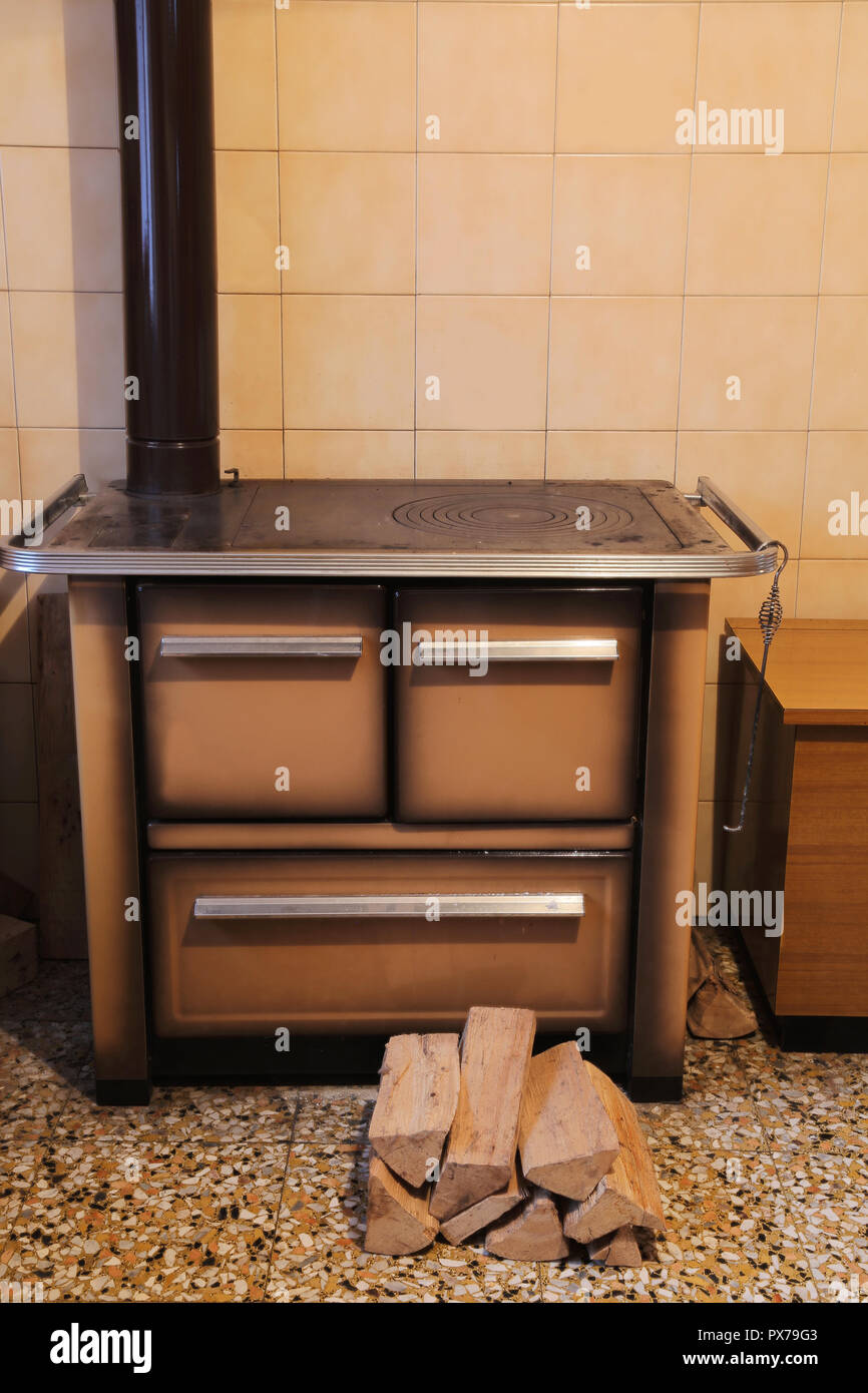 wood-burning stove in the kitchen of the small house Stock Photo - Alamy