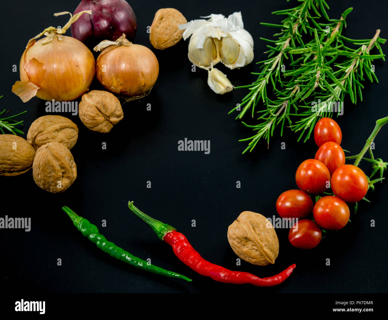 frame of different ingredients foods vegetables and herbs with spce in the middel for text Stock Photo