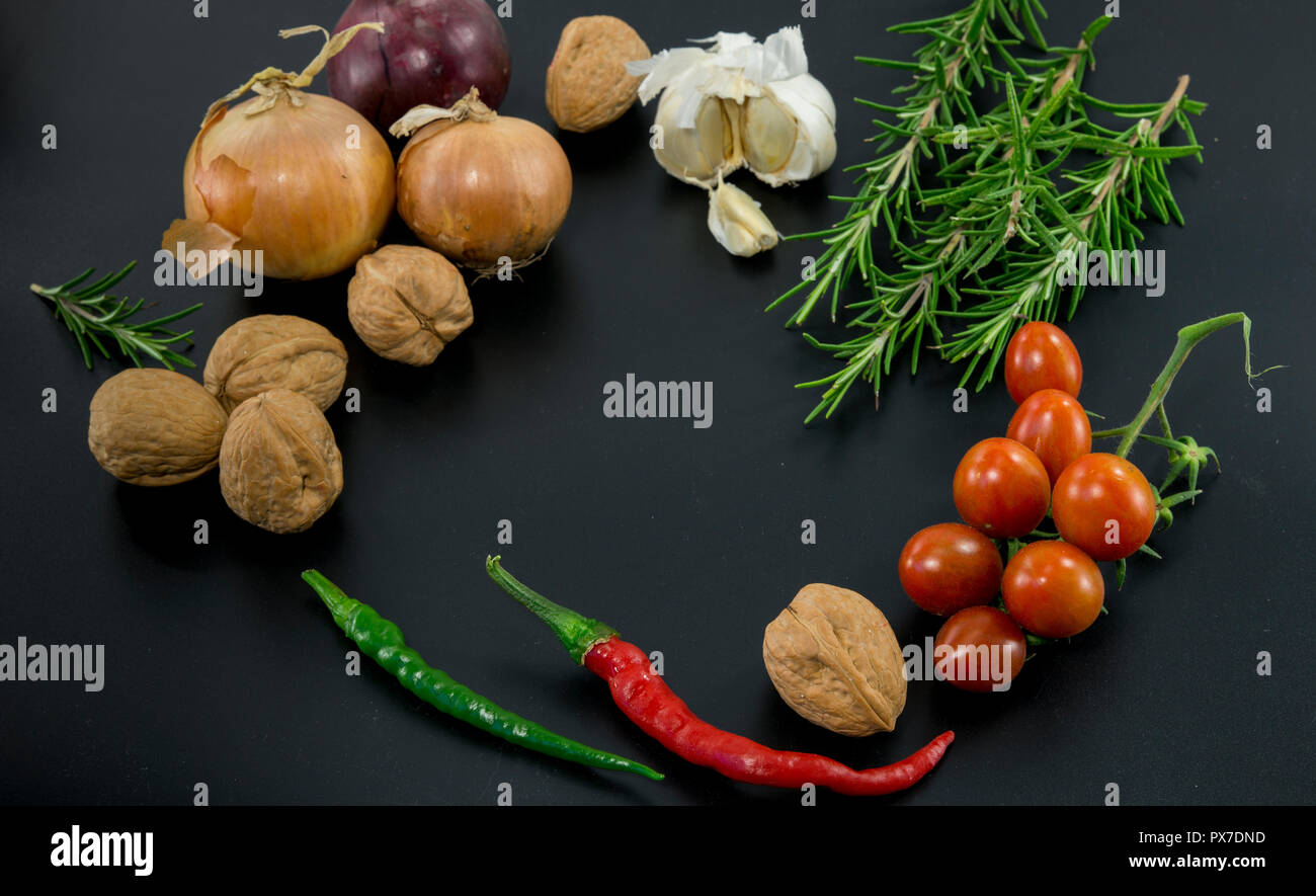 frame of different ingredients foods vegetables and herbs with spce in the middel for text Stock Photo